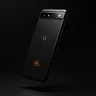 Black smartphone with a reflective surface, showing a 'G' logo and a flame icon on the back.